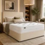 Double Divan Bed with Mattress in cream fabric styled in a modern UK bedroom with upholstered headboard and luxury mattress